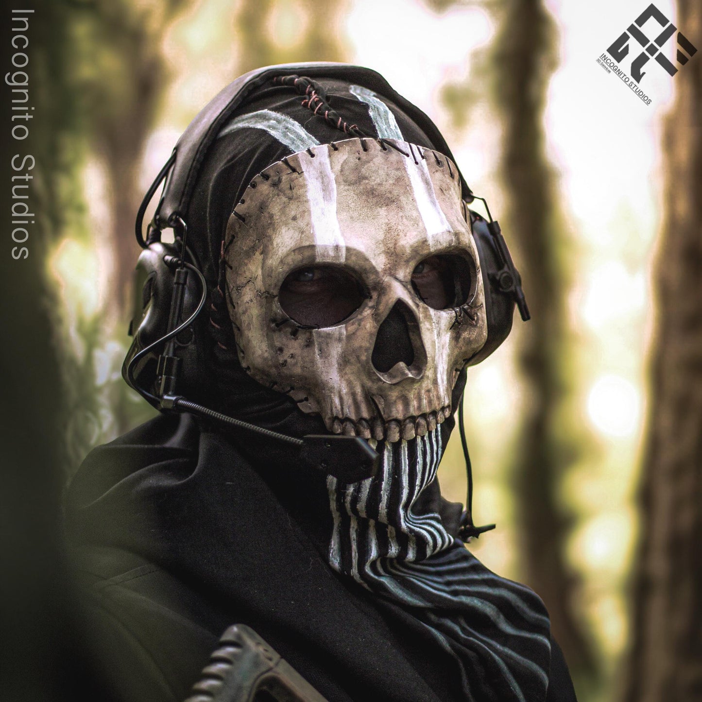 Person wearing a skull mask and headphones in a forest setting